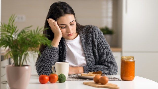 unhappy-woman-lost-appetite-not-hungry-breakfast